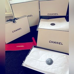 Chanel boxes with proper tissue and cover bags.